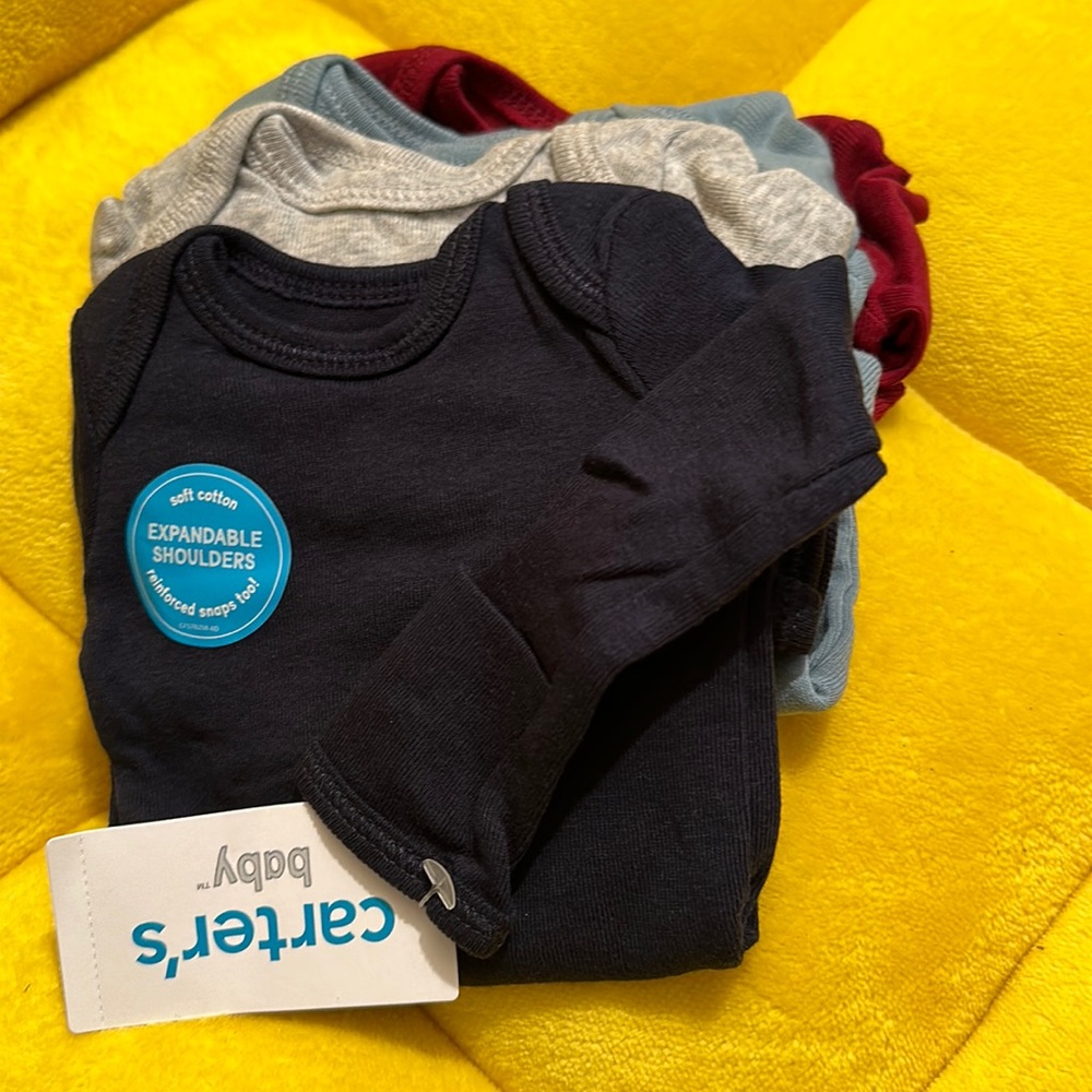 NWT Carter’s baby 4 pack long sleeve Bodysuits  -Solid